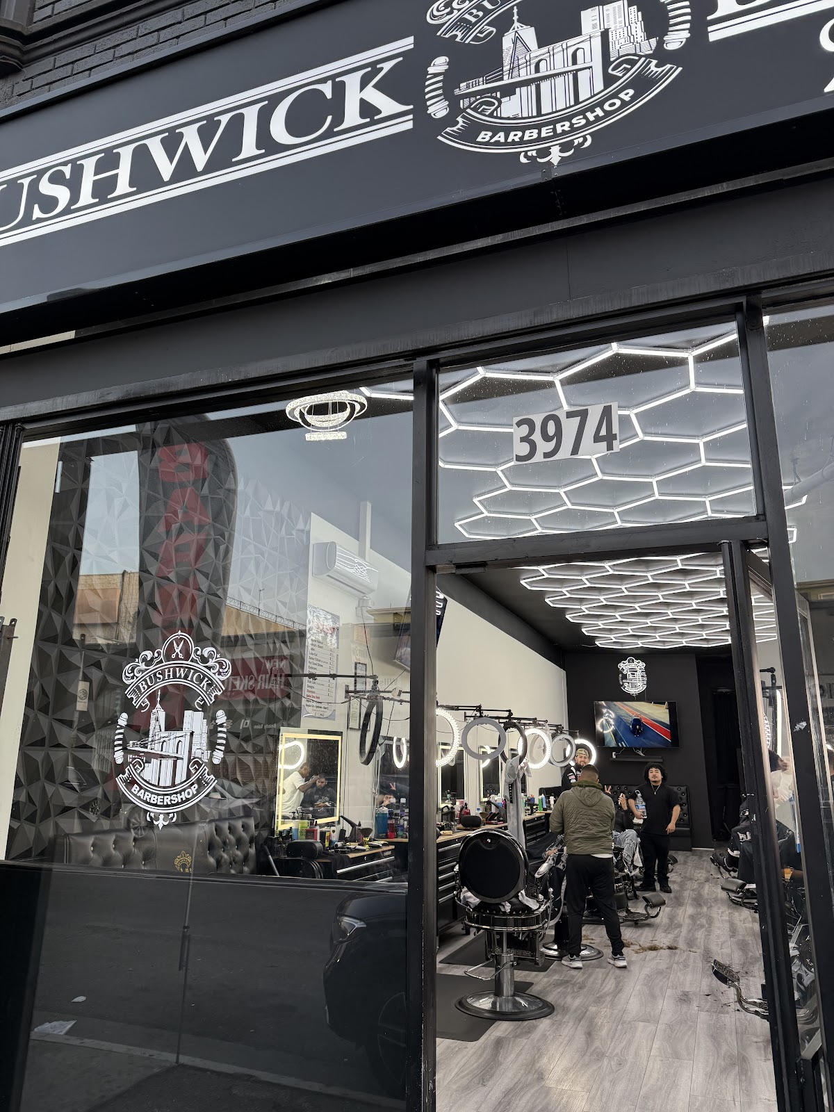 The Bushwick Barbershop crest on the storefront window in Koreatown